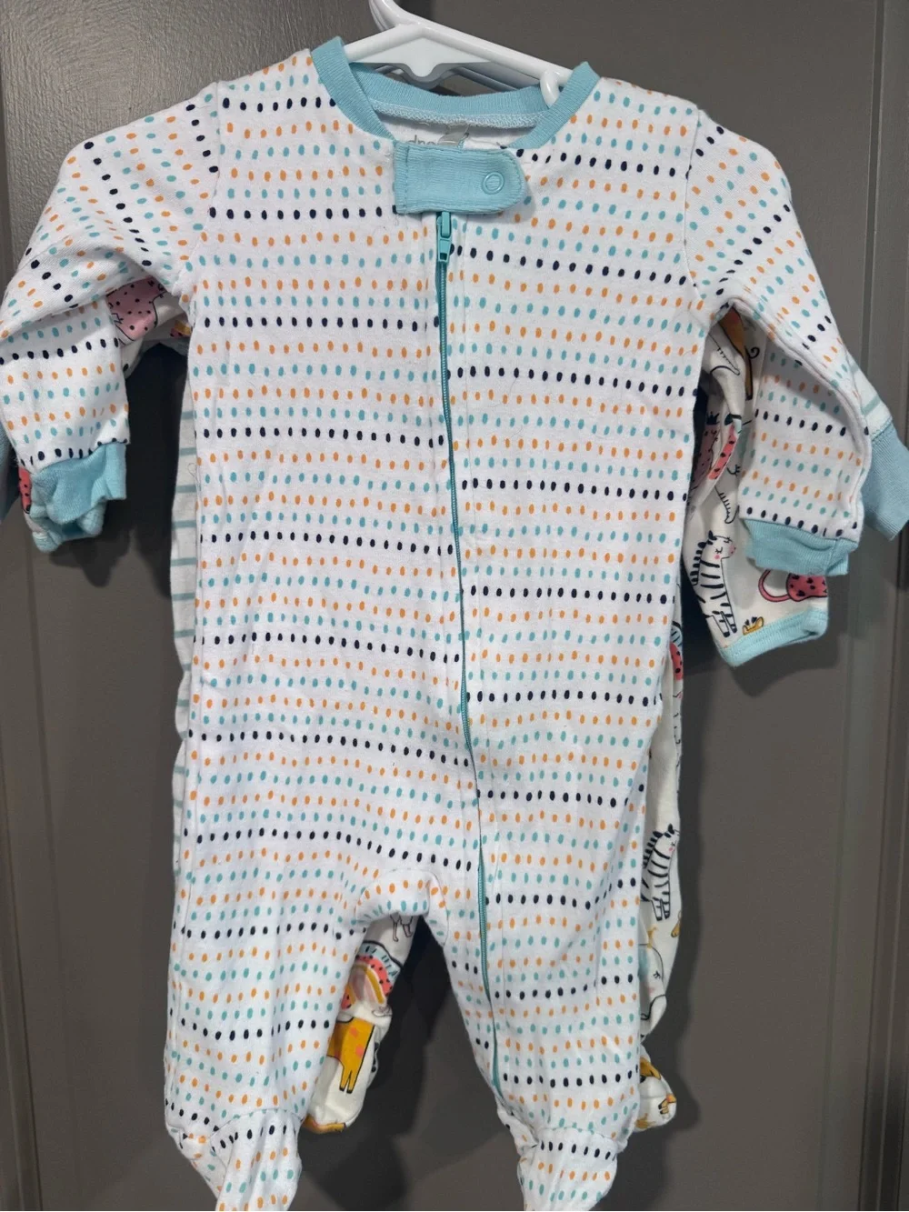 Three piece lot of light weight footed Pajamas, gender neutral.